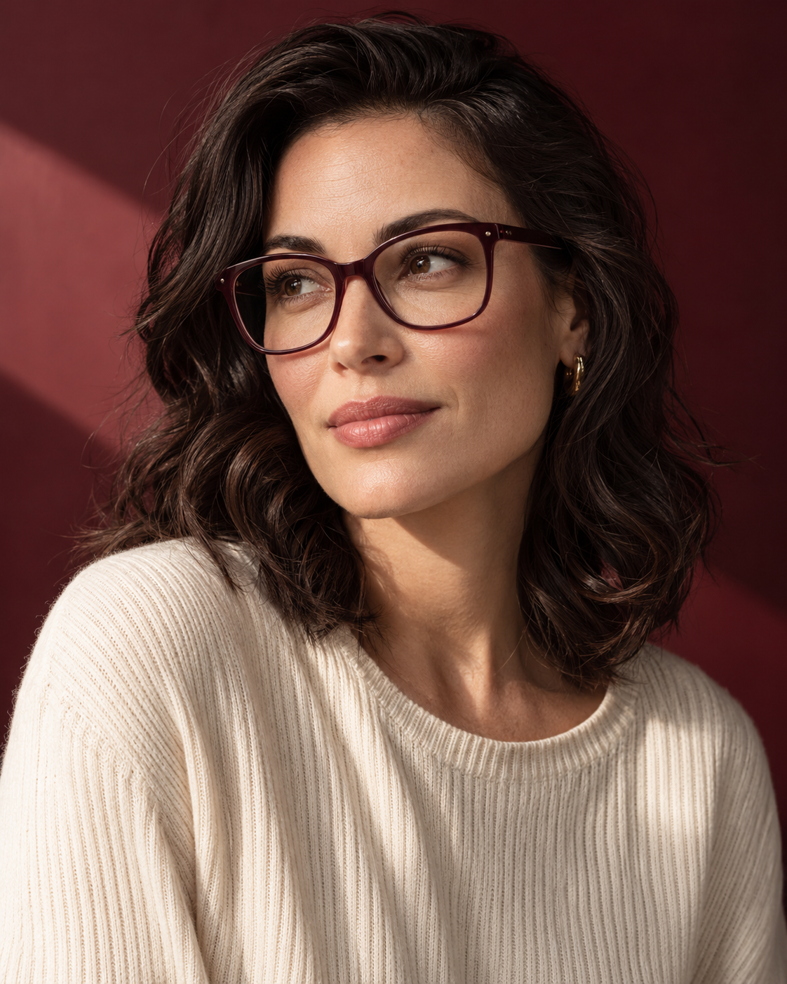Editorial concept: a woman wearing burgundy glasses